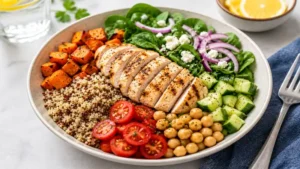 Colorful quinoa bowl with grilled chicken and roasted vegetables for nutritious weight watchers lunch meals.